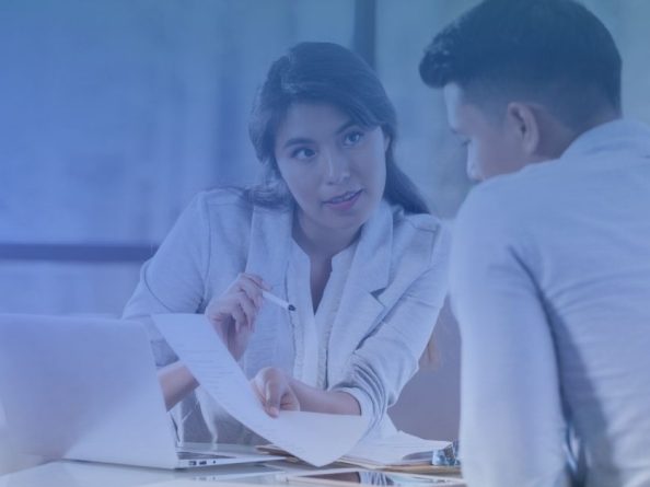 prior authorization modernization displayed with two clinical payer nurses discussing paperwork